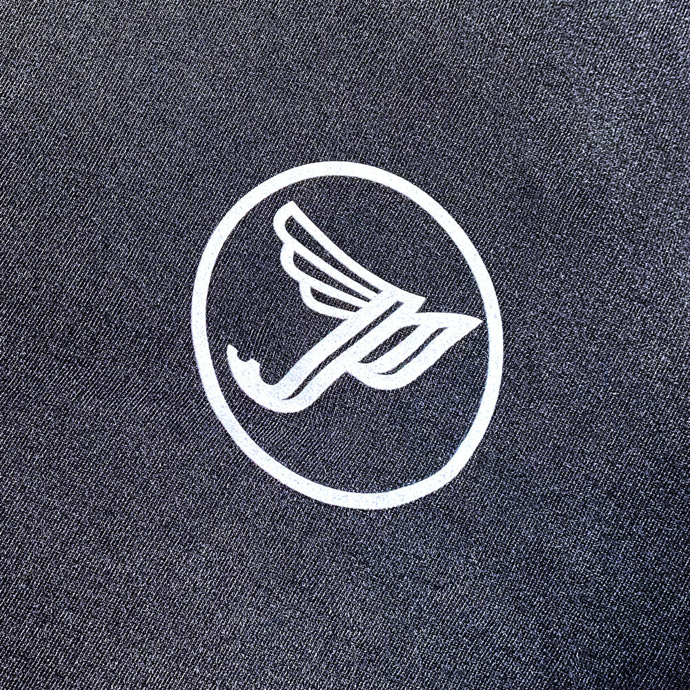 A close up of a black Crewneck Sweatshirt with a white Pixies "Circle P" logo on the chest.