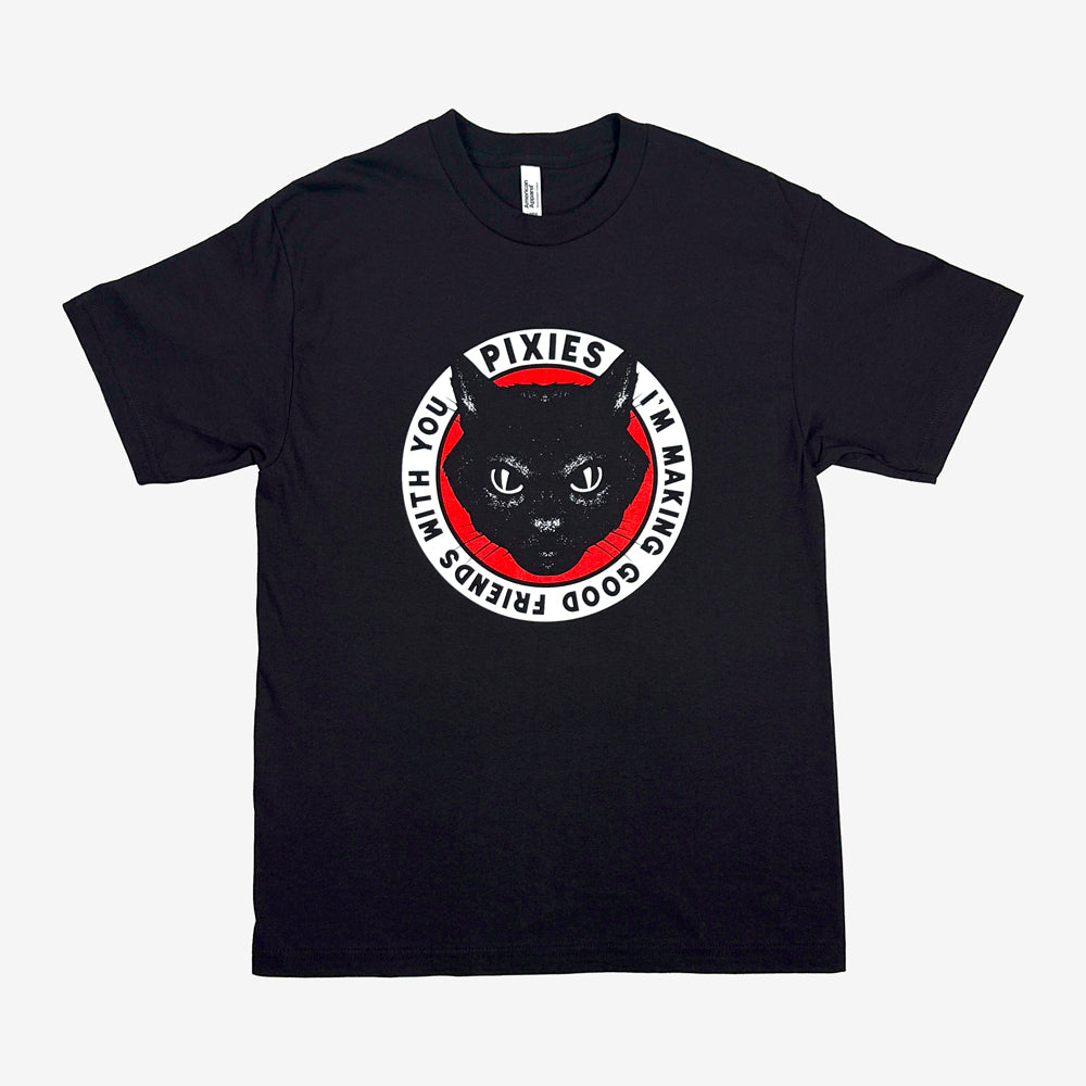 A black t shirt against a white background with a white circular design with black text reading "Pixies I'm making good friends with you." The inside of the circle is red and there is a design of black cat's head inside the circle.