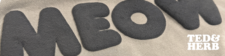 Text 'MEOW' in large, stylized letters on a textured beige background with 'TED & HERB' branding.